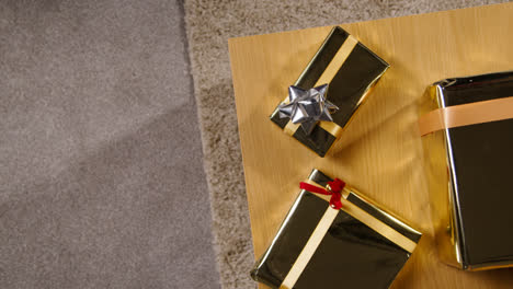 Overhead-Shot-Of-Gifts-Or-Presents-Wrapped-On-Table-At-Home-1